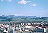 Louny (east) city before  Czech central mountains  in centre picture Mt. Milesovka 837 m